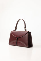 Maroon Structured Faux Leather Handbag with Tassel Detail-Zavy Vibes