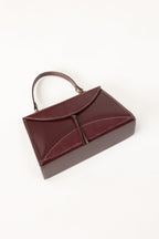 Maroon Structured Faux Leather Handbag with Tassel Detail-Zavy Vibes