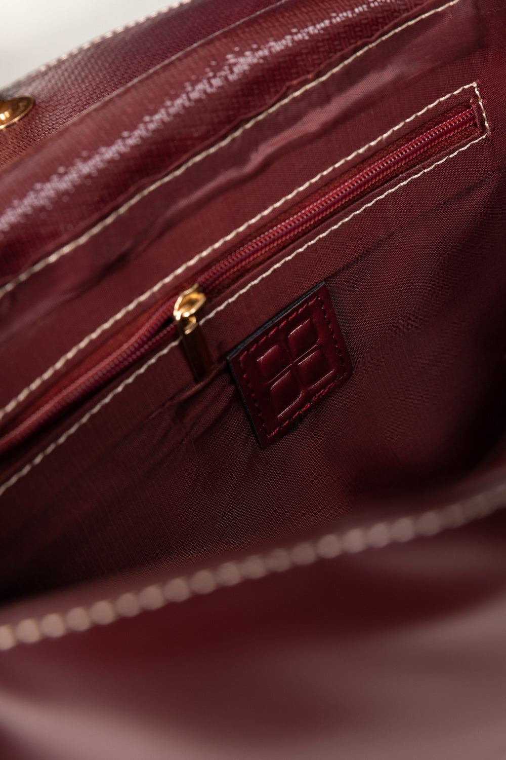 Maroon Structured Faux Leather Handbag with Tassel Detail-Zavy Vibes